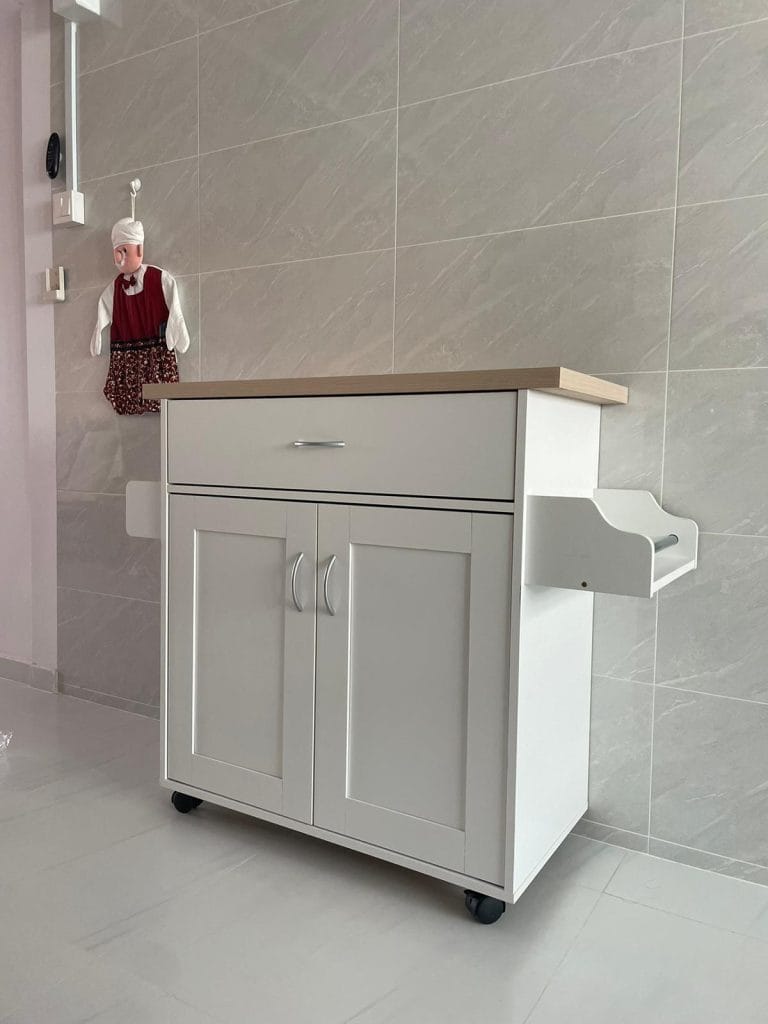 a white cabinet with a wooden top and a wooden counter top